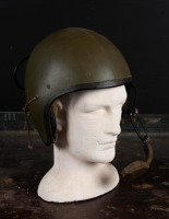 US MILITARY HELMET: A Vietnam war era combat vehicle crewman (CVC) helmet model, with headphones built in and adjustable microphone