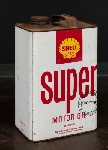 SHELL: A one gallon Super Shell Motor oil tin