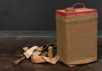 OIL TIN: A one gallon oil tin in military carry case