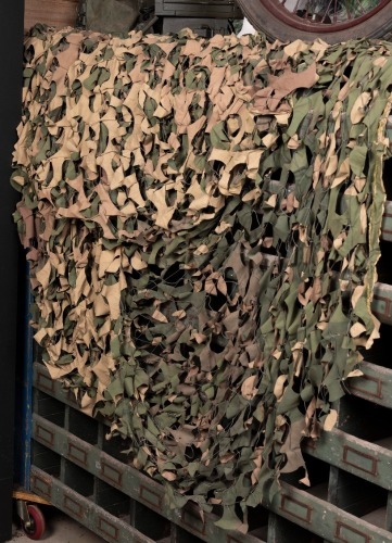 CAMOUFLAGE: A camouflage net, approx 200cm square