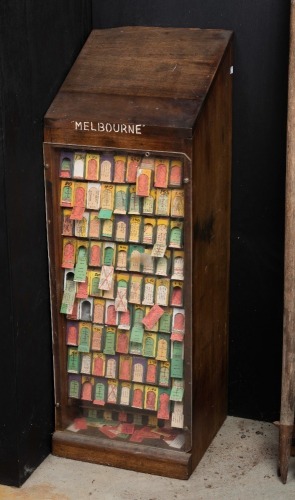 NSW RAILWAYS: An early 20th century hardwood train ticket cabinet with numerous NSW train tickets