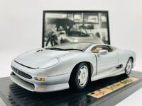 JAGUAR: A 1:18 scale model of the XJ220 by Maisto, mounted on plinth without original packaging together with a framed black and white photo of Kerry Manolas' XJ220 (K644 WJO) being unloaded, 33cm x 26cm - 4