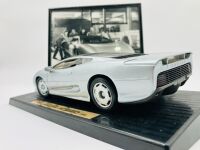 JAGUAR: A 1:18 scale model of the XJ220 by Maisto, mounted on plinth without original packaging together with a framed black and white photo of Kerry Manolas' XJ220 (K644 WJO) being unloaded, 33cm x 26cm - 5