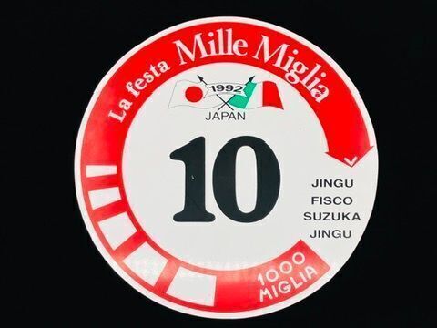 LA FESTA MILLE MIGLIA: A racing roundel with competitor no. 10 from the 1992 edition of the event held in Japan, mounted on board, 44cm diameter.