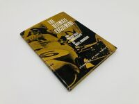THE ULTIMATE EXCITEMENT: A hardcover book subtitled "The Motor Race Photography of Nigel Snowden" compiled by Bill Tuckey. - 2