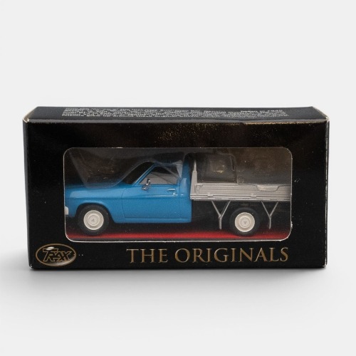 HQ ONE TONNER: A Trax 1:43 scale Holden HQ one tonner cab chassis drop side utility model, finished in light blue paintwork with a silver tray, model number TR45D