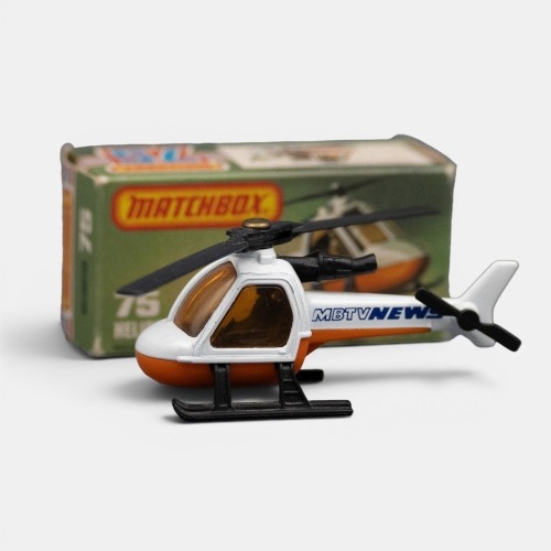 HELICOPTER: A Matchbox 1-75 helicopter model, finished in white paintwork over an orange base, has the MBTV news livery, model number 75, made in England