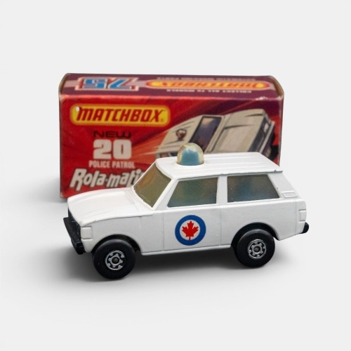 303 · POLICE: A Matchbox Rola-matics police patrol model, finished in white paintwork, with the maple leaf decals on the side, model number 20, made in England