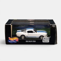 SHELBY MUSTANG: A 1:43 scale Hot Wheels collectibles 1966 Shelby GT350 model, finished in traditional white with blue stripes paintwork, model number 25559