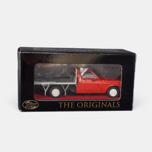 HQ ONE TONNER: A Trax 1:43 scale Holden HQ one tonner cab chassis flat bed utility model, finished in red paintwork with a silver tray, model number TR45