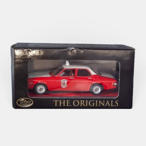HQ BELMONT: A Trax 1:43 scale Holden HQ Belmont sedan model, finished in white over red paintwork with the St George taxis livery, part of the Aussie taxi series of models, model number TR17G