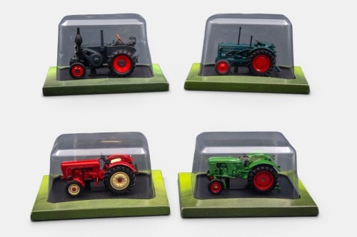 GERMAN TRACTORS: Four Hachette Partworks 1:43 scale German tractor models including 1938 Lanz Bulldog D 7506, 1953 Hanomag R28, 1958 Porsche Super, 1963 Deutz D25, all mounted onto black display bases, in original packaging