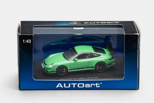 58A · PORSCHE: A 1:43 scale AutoArt, Porsche 911 (997) GT3 RS model, finished in green with black stripes paintwork, model number A57912, in all original packaging
