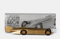 GOLDEN ARROW: A Schylling Models 1929 Golden Arrow land speed record car tin toy model, 50cm long, in original box with COA