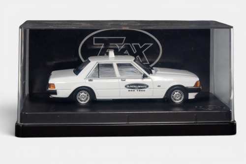 XD FALCON: A Trax 1:43 scale Ford XD Falcon GL taxi model, finished in white paintwork bearing the Black & White taxis livery, part of the Aussie taxi series collection, model number TR84E