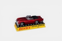 ASTON MARTIN: A Dinky toys Aston Martin DB5 model, finished in dark red paintwork, this is an Atlas edition, model number 110