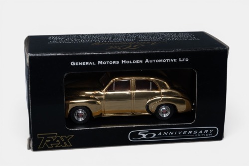 31 · FX HOLDEN: A Trax 1:43 scale Holden FX sedan, finished in gold paintwork, 50th anniversary edition, model number TRG15