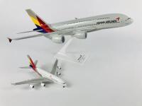 ASIANA AIRBUS A380: 2 Models (longest 36cm): A 1:200 scale plastic model, registration 'HL7625', and A 1:500 scale metal model on wheels, registration 'HL7388'. - 2