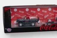 CHEVROLET: A 1:64 scale M2 hauler set of models, consisting of a 1973 Chevrolet K5 Blazer with a 1968 Pontiac Firebird on a trailer, all wearing the iconic Coca-Cola livery, model number TW18, limited edition 8400 pieces - 2