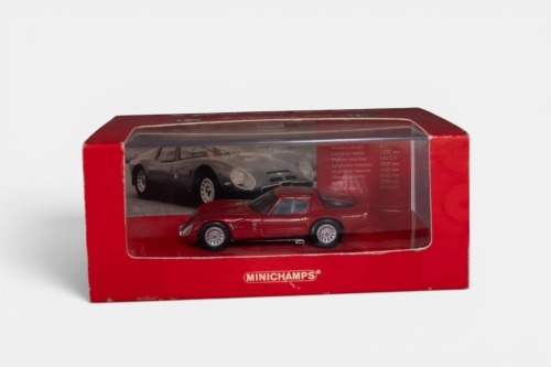 ALFA ROMEO: A 1:43 scale Minichamps 1965 Alfa Romeo Giulia TZ 2 model, finished in dark red paintwork, in a special larger size packaging with unique Alfa Romeo sleeve, model number 403 651203