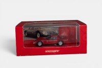 ALFA ROMEO: A 1:43 scale Minichamps 1965 Alfa Romeo Giulia TZ 2 model, finished in dark red paintwork, in a special larger size packaging with unique Alfa Romeo sleeve, model number 403 651203