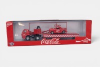 DODGE: A 1:64 scale M2 hauler set of models, consisting of a 1969 Dodge L600 truck with a 1941 Willys coupe on the flat bed trailer, all wearing the iconic Coca-Cola livery, model number TW14, limited edition 8400 pieces
