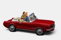 A limited edition (No.85079) resin sculpture by Guillermo Forchino titled '65 Ford Mustang convertible' featuring a loving couple within a convertible, measures approximately 35cm in length, 15cm width, in as-new condition, within box.