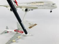 EMIRATES AIRBUS A380: 2 models (longest 38cm): A 1:200 scale resin model, registration 'A6-EDA', on stand with wheels. And A 1:500 scale metal model on wheels, registration 'A6-EDA' - 3