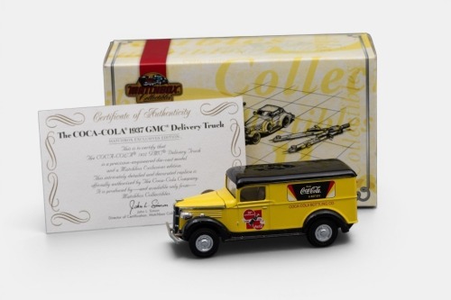 GMC: A Matchbox collectibles model, of a 1937 GMC delivery van, finished in yellow paintwork with a Coca-Cola livery, model number YYM92014