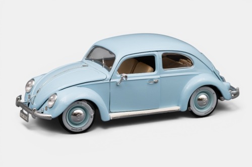VOLKSWAGEN: A Bburago 1:18 scale Volkswagen Kafer Beetle model, finished in light blue paintwork with cream interior, part of the gold collection, model number 3381