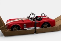 AC COBRA: A Retro Delights modern metal AC Cobra in red with white stripes, 31cm long