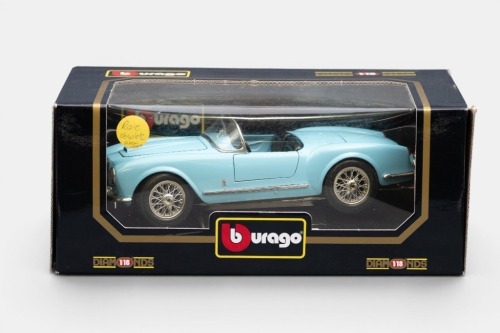 LANCIA: A Bburago 1:18 scale 1955 Lancia Aurelia B24 spider model, rare obsolete black seat option model, model number 3010, in original packaging, some yellowing to plastic