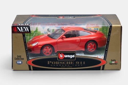 273 · PORSCHE: A Bburago 1:18 scale 1997 Porsche 911 Carrera model, finished in red paintwork with black interior, part of the gold collection, an idee+spiel exclusiv limited edition release, model number 3385