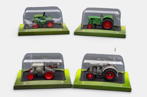 116 · DEUTZ TRACTORS: Four Hachette Partworks 1:43 scale Deutz tractor models including 1929 MTZ 120, 1938 F2M315, 1950 F1L514, 1963 D25, all mounted onto black display bases, in original packaging