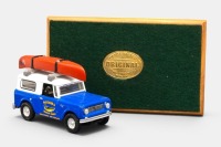 INTERNATIONAL: A 1961 International Scout 80 model, finished in the Mataura brown trout livery, this is a code 3 model, with the model mounted onto a customised wooden plinth, titled Koru Care 2000, limited edition number 6 of 15 - 2
