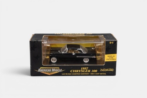 225 · CHRYSLER: A 1:43 scale American Muscle 1957 Chrysler 300 model, finished in black paintwork, model number 32127