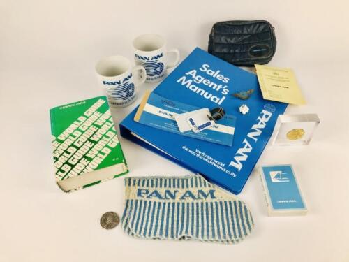 PAN AM EPHEMERA: Twelve items: Pan Am unopened card deck circa 1959 , Pan Am 'Junior Clipper Pilot' wings pin 1959, Pan Am ticket cover 1959, Pan Am American and Israel flags with Pan Am logo promotional pin 1990's, Pan Am International Certificates of 