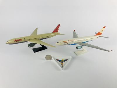 AUSTRIAN AND LAUDA AIR: 3 items: A 1:100 scale (32cm long) Austrian Airlines Airbus A330-220 plastic model, registration 'OE-LAN', A 1:100 scale Lauda Boeing 777-300 plastic model, registration 'OE-LPA' and one Lauda Air triangular serving plate.