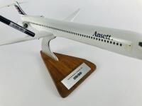 ANSETT MD90: A 1:100 scale (48cm long) wooden 'McDonnell Douglas' model. - 3