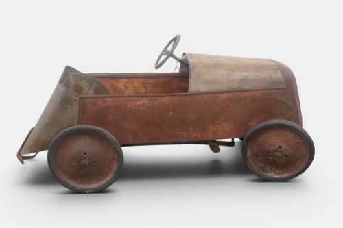 PEDAL CAR: A circa 1950s metal bodied pedal car, possibly by Cyclops