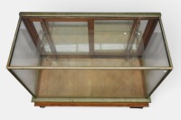 DISPLAY CABINET: An early 20th century display cabinet, with metal claw feet, one detached but present - 2