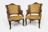 BERGERE: A pair of Louis XVI style carved giltwood and caned bergere, upholstered in gold brocade