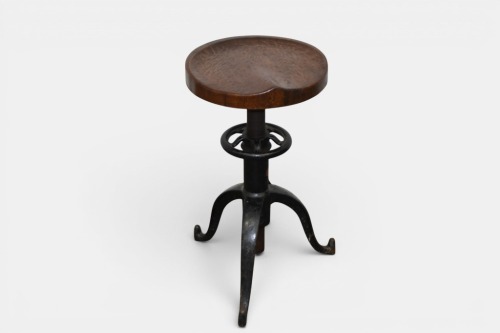 STOOL: An antique cast iron and wood stool by 'Satellite Adjustable Table Co, Grand Rapids Mich', 68cm high