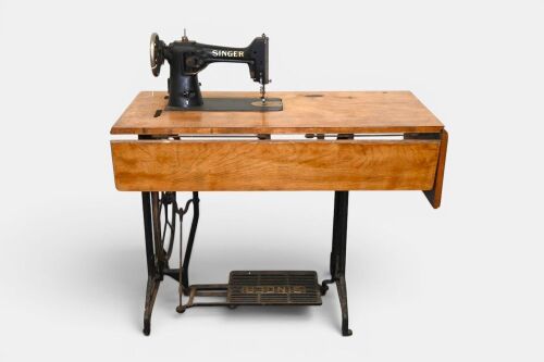 SEWING MACHINE: A Singer sewing machine and table