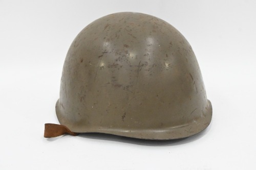 HELMET: A vintage military helmet, with leather internal