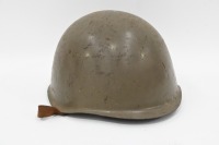 HELMET: A vintage military helmet, with leather internal