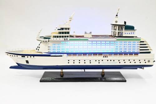 MODEL BOAT: A wooden model of the Royal Caribbean 'Explorer of the Seas' cruiseliner displayed on timber base, 40cm high overall, 80cm long