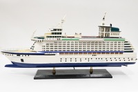 MODEL BOAT: A wooden model of the Royal Caribbean 'Explorer of the Seas' cruiseliner displayed on timber base, 40cm high overall, 80cm long - 2