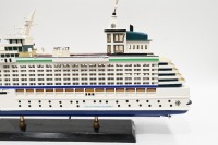 MODEL BOAT: A wooden model of the Royal Caribbean 'Explorer of the Seas' cruiseliner displayed on timber base, 40cm high overall, 80cm long - 3