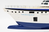 MODEL BOAT: A wooden model of the Royal Caribbean 'Explorer of the Seas' cruiseliner displayed on timber base, 40cm high overall, 80cm long - 5